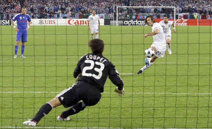 Andrea Pirlo fires his penalty past the French goalkeeper Grégory Coupet to give Italy a 25th-minute lead in Zurich last night