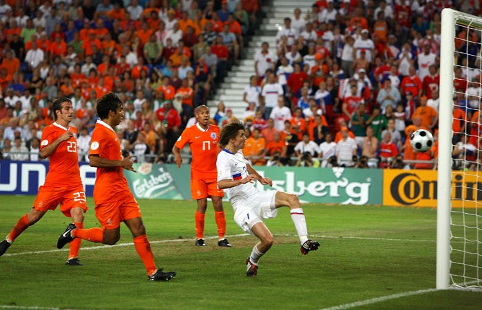 Dmitry Torbinsky gets his foot to a brilliant cross from Andrei Arshavin to score Russia's second goal