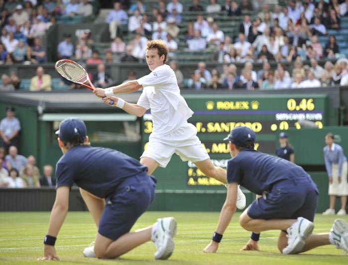 Two Wimbledon ballboys enjoy the best view in the house to watch Andy Murray defeat France's Fabrice Santoro