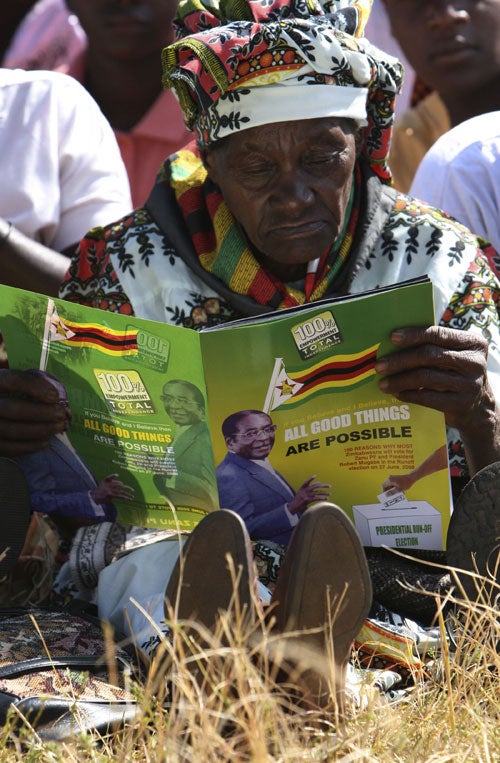 A woman at President Robert Mugabe's rally west of Harare