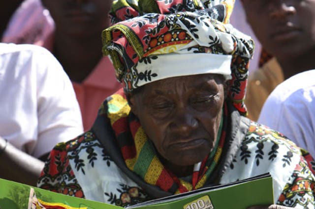 A woman at President Robert Mugabe's rally west of Harare