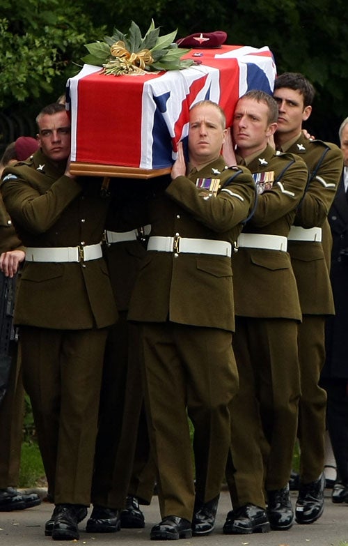 The coffin of Private Charles David Murray is carried by colleagues athis funeral