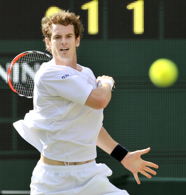 Murray hits out during his third-round victory over Tommy Haas on Centre Court