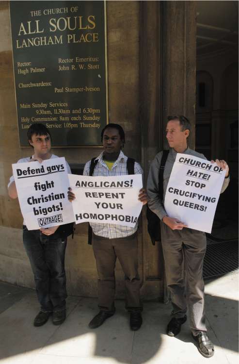 Brett Lock, (left) Kizza Musinguzi and Peter Tatchell after their ejection from All Souls Church in central London yesterday