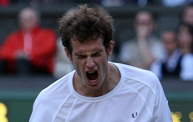 Murray roars in frustration during his 6-3, 6-2, 6-4 defeat at the hands of Rafael Nadal on Centre Court last night