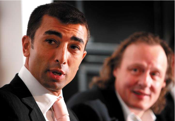 The new MK Dons manager Roberto Di Matteo (left) sits with the chairman, Pete Winkelman, at his unveiling yesterday