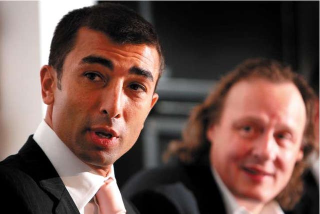 The new MK Dons manager Roberto Di Matteo (left) sits with the chairman, Pete Winkelman, at his unveiling yesterday