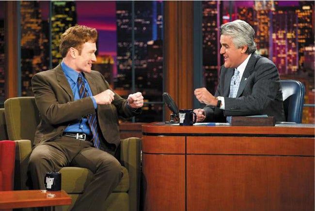 Tonight Show host Conan O'Brien (left) is angry that his programme will be aired at a later time to accommodate the rival show of his predecessor, Jay Leno (right)