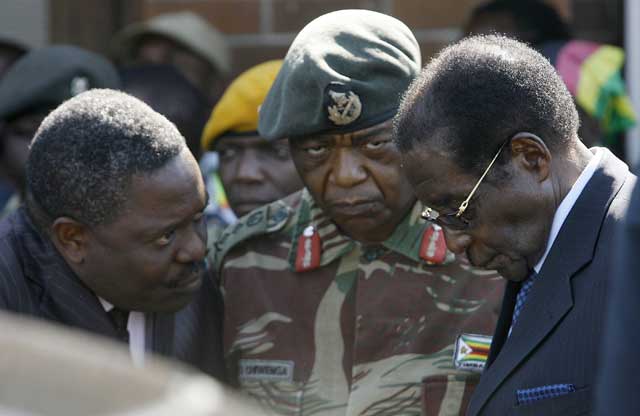 Happyton Bonyongwe (left), head of the secret service, army chief Constantine Chiwenga and Robert Mugabe earlier this month