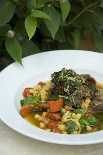 The lamb is accompanied with a burst of summer vegetables and herbs