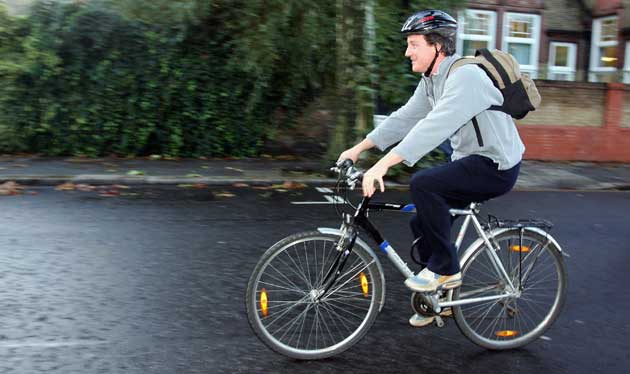 David Cameron gets on his bike