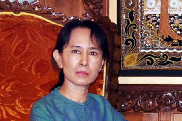 Aung San Suu Kyi said she did not violate her house arrest by admitting a man who swam to her lakeside home