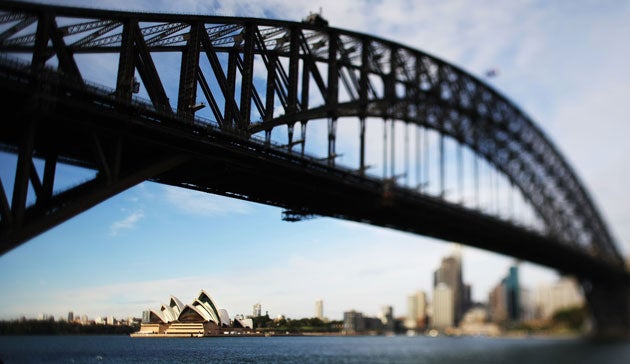 Seen through the harbour bridge, Sydeney Opera House is one of the world's most recognisable buildings