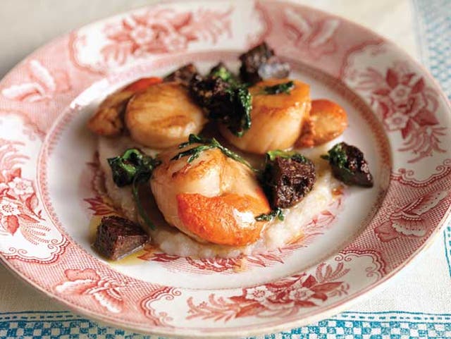 Place the scallops on top of the Jerusalem artichoke purée then spoon the butter and black pudding over