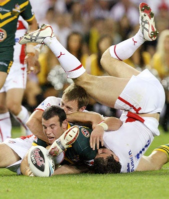 Australian and English players in action during their Rugby League World Cup match