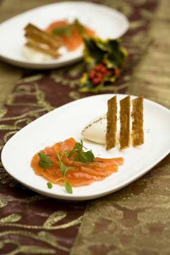Sprinkle the salmon with black pepper and garnish with salad cress