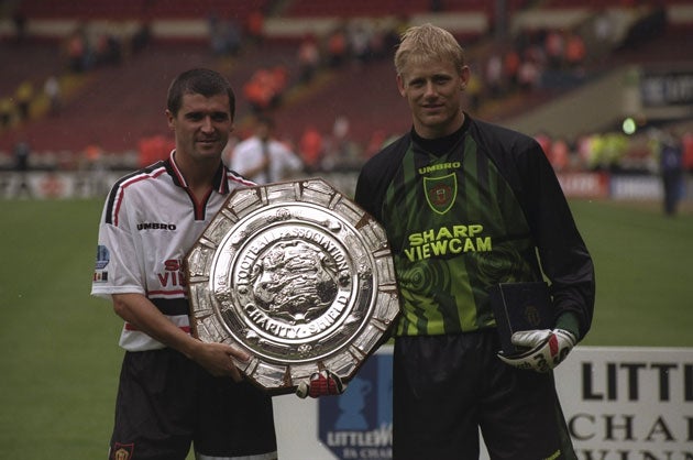 The pair during happier times in 1997, holding the Charity Shield