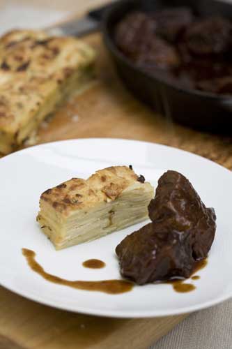 Serve the bake with braised beef and a glass of full-bodied red wine