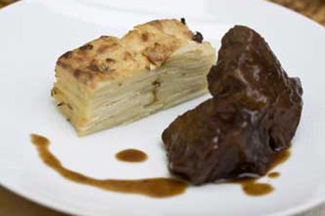 Serve the bake with braised beef and a glass of full-bodied red wine