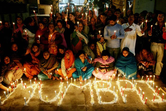 People light candles as they pay tribute to the victims of the Mumbai terror  in 2008