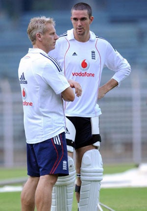 Kevin Pietersen (right) and Peter Moores (left) are said to have been at odds for months, and it is believed they became more distant in India