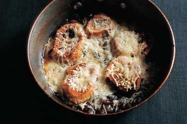 Cover the baguette toasts with grated cheese, place on top of the soup and place under the grill to gratinate the dish.