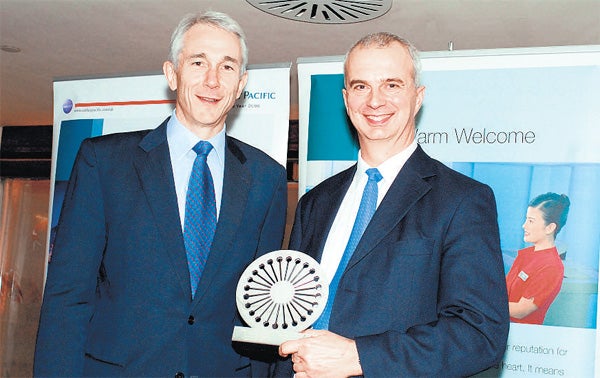 Shine on: Philip Pike of Andor Technology (right) receives his rising star award