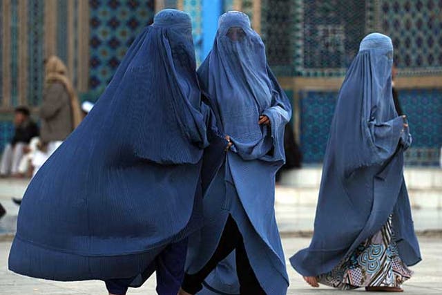 Afghan women pictured taking a walk