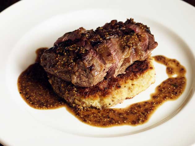 Lay the lamb on the pearl-barley cakes and pour the sauce around