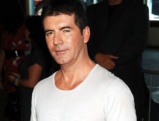 Simon Cowell's two Saturday night ITV talent shows were beaten in the entertainment category by BBC4's Newswipe With Charlie Brooker, prompting a huge cheer from the crowd at the Grosvenor House Hotel in London.