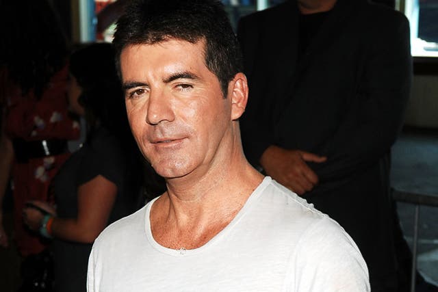 Simon Cowell's two Saturday night ITV talent shows were beaten in the entertainment category by BBC4's Newswipe With Charlie Brooker, prompting a huge cheer from the crowd at the Grosvenor House Hotel in London.