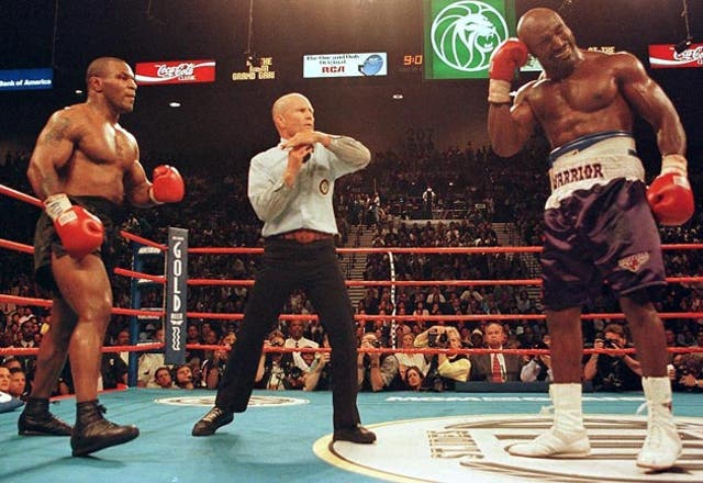 <p>Mike Tyson (left) famously bit into Evander Holyfield’s ear</p>