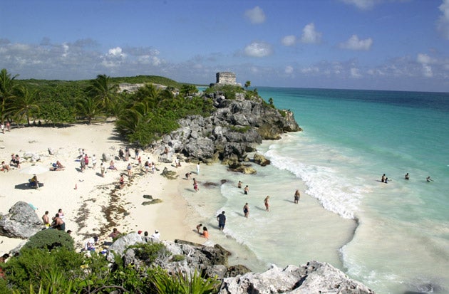 Tourists near the ancient Maya city at Tulum