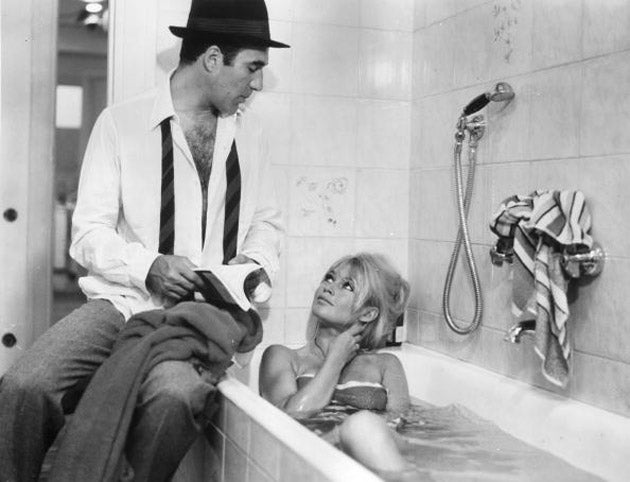 &#13;
Making a splash: Piccoli with Brigitte Bardot in Jean-Luc Godard’s ‘Contempt’ (Getty)&#13;