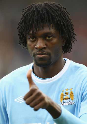 Former Arsenal striker Emmanuel Adebayor celebrated his goal - City's third - in front of furious visiting fans