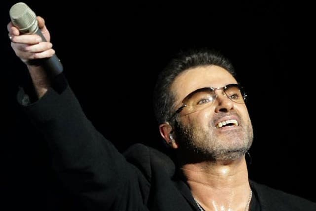 Singer George Michael was charged when he reported to a police station in Camden