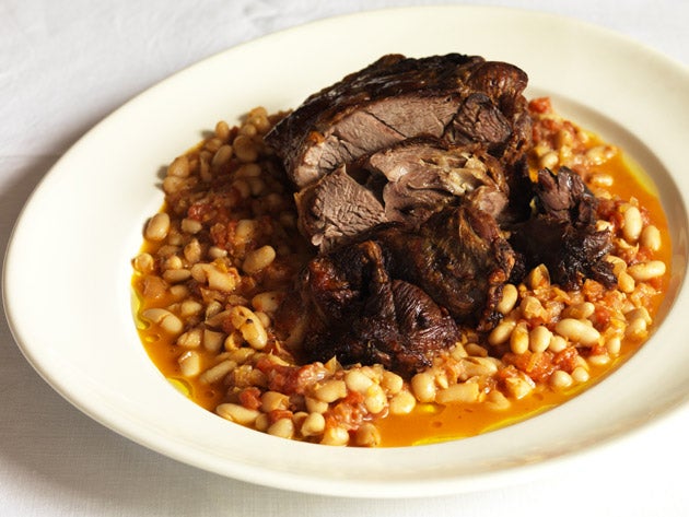 Cut the lamb in to slices, transfer to a serving dish and spoon the beans around