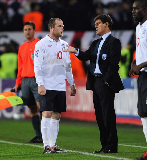 Wayne Rooney absorts words of wisdom from Fabio Capello, who successfully tried new formations