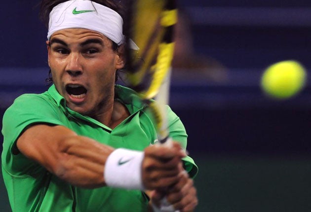 Spain's Rafael Nadal hits a return during his victory over compatriot Feliciano Lopez - Nadal plays Nikolay Davydenko in today's Shanghai Masters final
