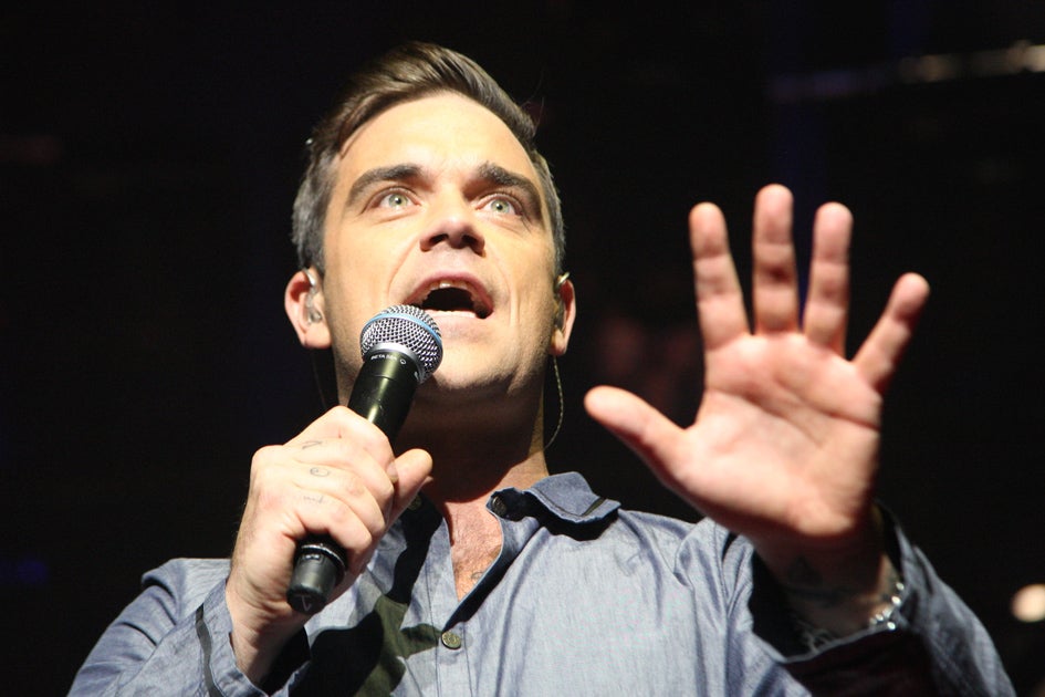 Former Take That star Robbie Williams is reuniting with the band for a charity single in aid of the Haiti earthquake vicitms.
