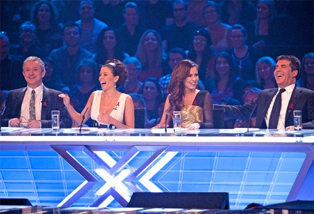 Simon Cowell, right, with fellow X Factor judges Louis Walsh, Dannii Minogue and Cheryl Cole