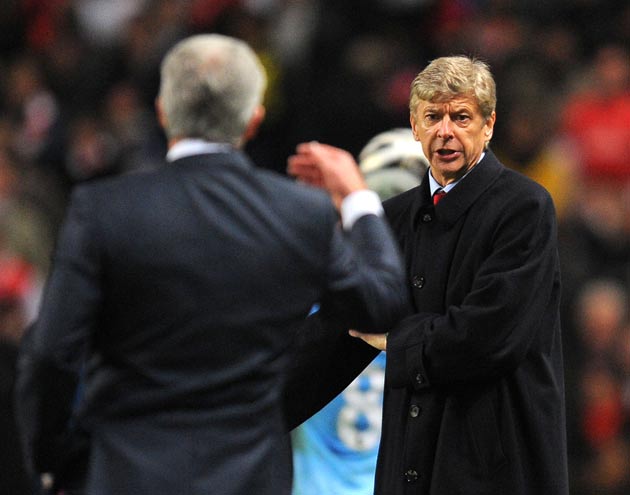 Wenger exchanges word with Hughes during the Carling Cup