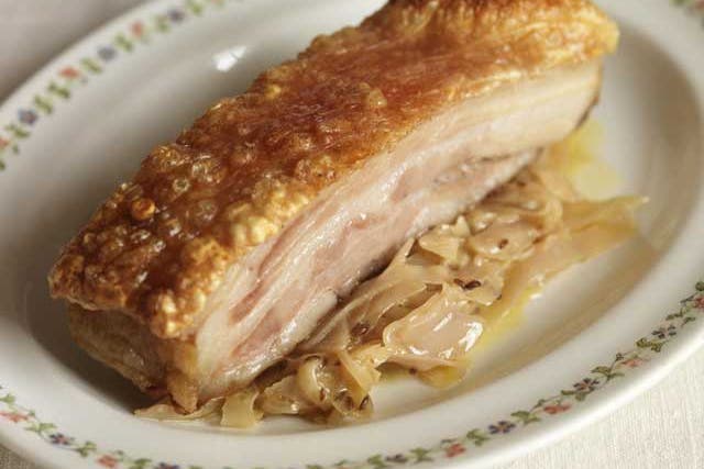 Slice the pork belly or leave it as a chunk, spoon the cabbage on to warmed plates and lay the pork on top