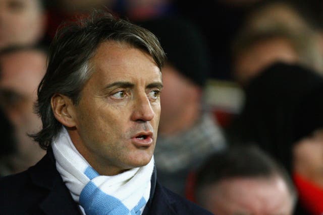 City manager Roberto Mancini (above) was involved in a touchline bust up with Everton boss David Moyes during their sides' Premier League fixture last night
