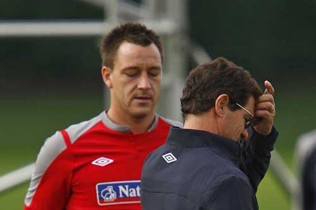 Fabio Capello (right) stripped John Terry or the captaincy