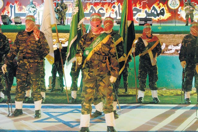 <p>Some of the T-shirts supported the armed wing of Hamas (pictured) </p>