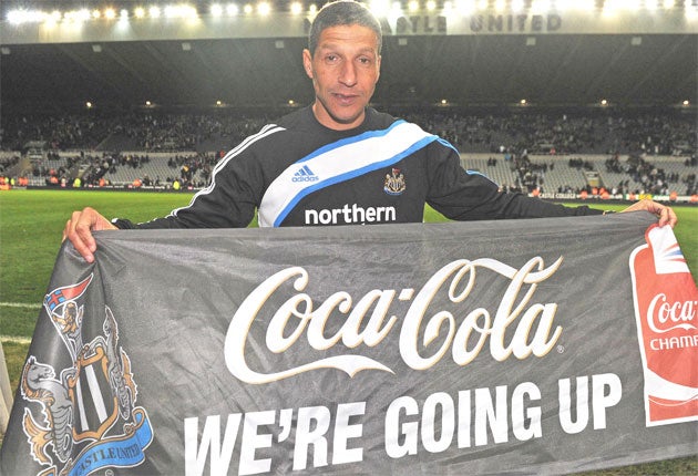 The Newcastle United manager, Chris Hughton, celebrates promotion to the Premier League