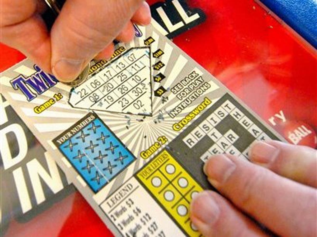 Landscaper collects half a million pound winnings from lottery ticket ...