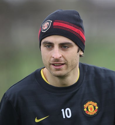 Berbatov (above) could lead United's attack at the start of next season after Wayne Rooney's busy summer with England