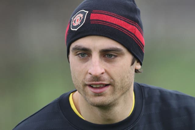 Berbatov (above) could lead United's attack at the start of next season after Wayne Rooney's busy summer with England